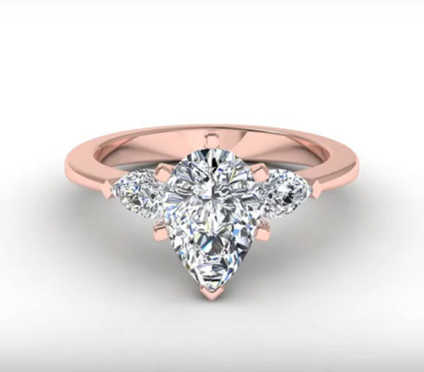 LOVELY PEAR-SHAPE DIAMOND THREE STONES RING